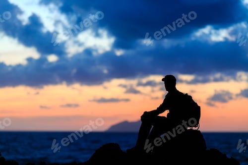 Preview: Hiking silhouette backpacker, man trail runner in mountains