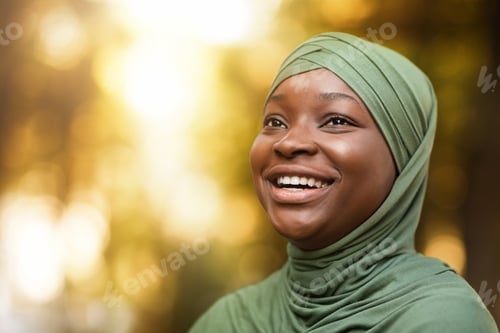 Preview: Closeup Portrait Of Laughing Black Muslim Lady In Hijab Standing Outdoors