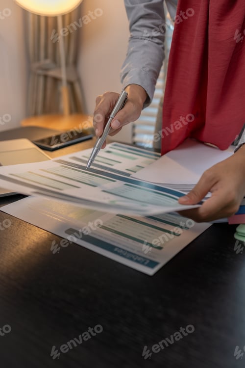 Preview: a muslim female entrepreneur is reviewing her company's financial documents