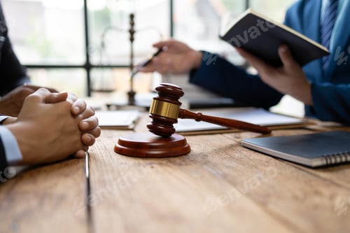 Preview: Lawyer is giving legal advice to a businessman in the legal counsel's office.