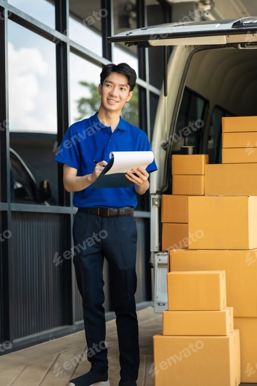 Preview: Asian delivery man work in truck for checking the product in the truck, concept ecommerce.