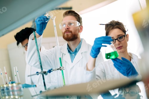 Preview: Young students of chemistry working in laboratory