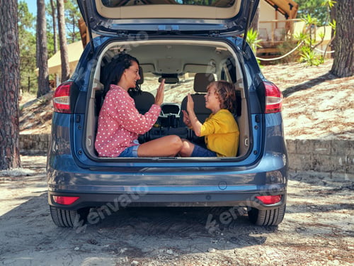 Preview: Mother with son playing in car truck