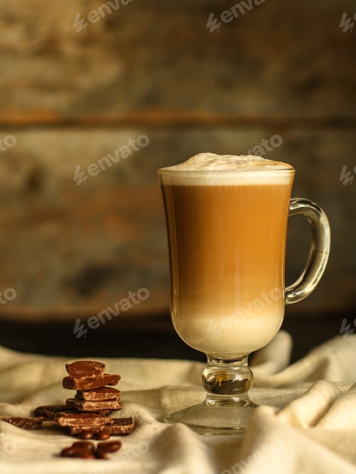 Preview: Latte - A Cup Of Coffee With Milk In A Transparent Cup On The Table. Top View.