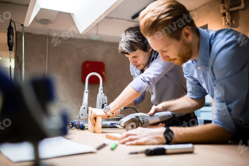 Preview: Two creative designers working in workshop