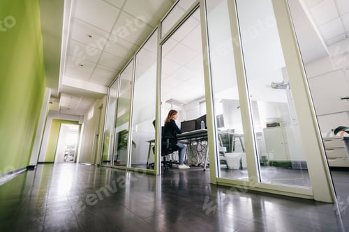 Preview: Woman working in modern office