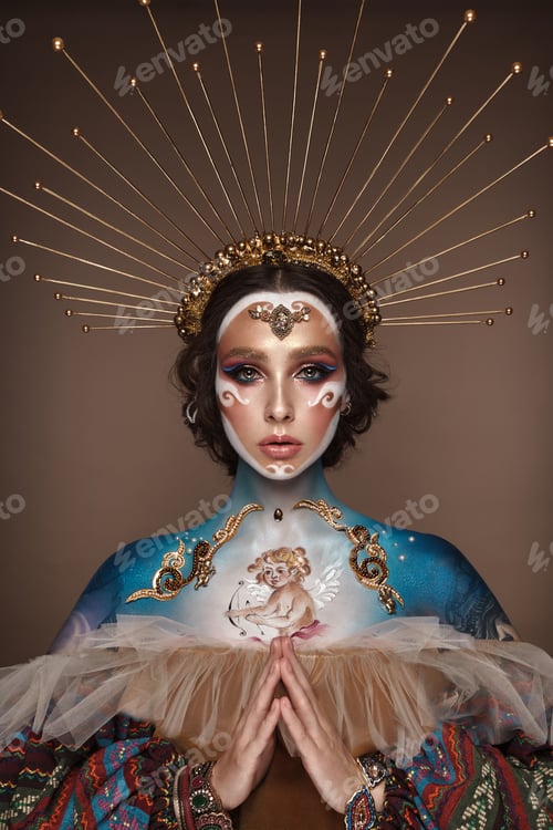 Preview: Portrait of a girl with gold and blue creative art make-up.