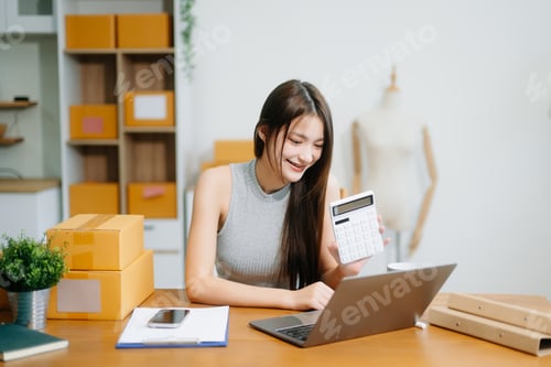 Preview: Small business entrepreneur SME freelance woman working at home office, BOX,tablet and laptop