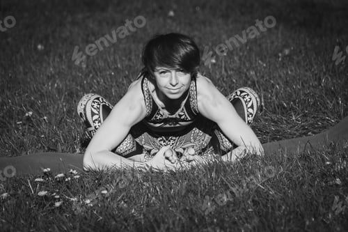 Preview: Yoga. The Girl In The Park Is Practicing Yoga