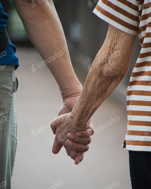 Preview: a young person accompanying a senior by holding hands