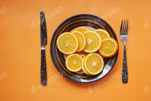 Preview: close up of slice of orange fruit on a plate