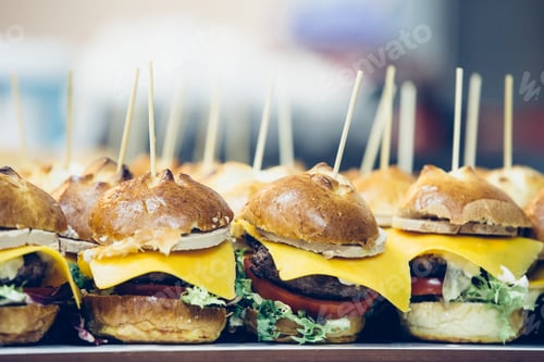 Preview: Delicious Gourmet Mini Burgers Lined Up on Display