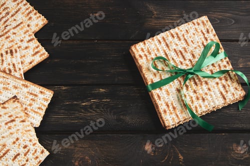 Preview: Matzah background. Happy Passover. Traditional Jewish regilious holiday Pesach. Matzo bread on dark