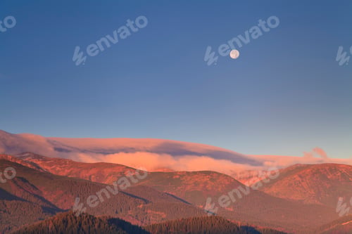 Preview: Moonrise in the mountains at dawn