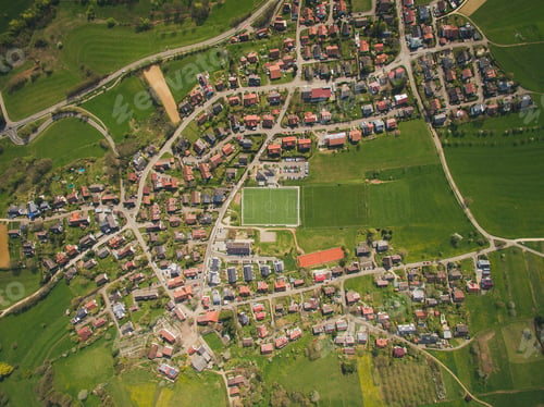 Preview: Aerial view of town and green soccer stadium in Germany