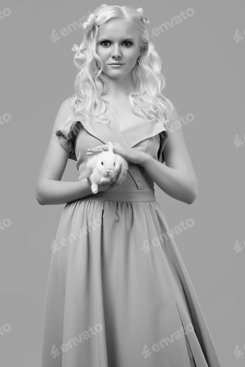 Preview: Fashion Portrait Of Albino Blond Girl With White Skin And Blue Eyes In Elegant Dress Posing With