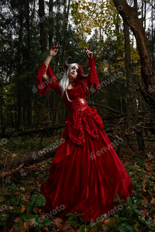 Preview: Stylish and fashionable model girl in the image of Maleficent posing among mystic forest - fairytale