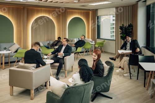 Preview: Diverse businesspeople collaborate at cozy conference, exchanging ideas and partnerships for growth