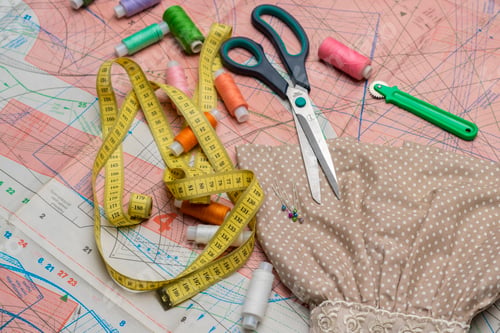Preview: sewing supplies flat lay. colorful threads, scissors b