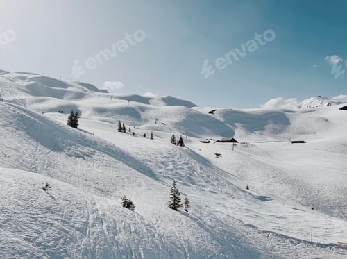 Preview: Snowy white mountain valley covered in snow on a sunny day
