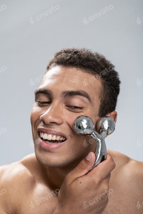Preview: Young male relaxing during his face massage