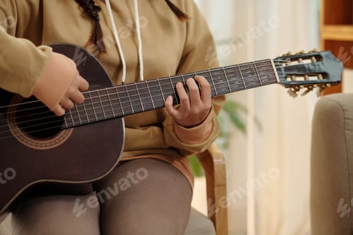 Preview: Teenage Girl Playing Guitar