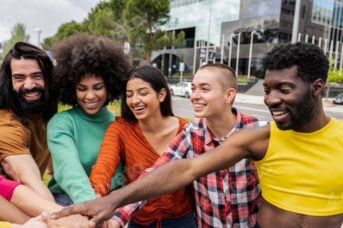 Preview: group of diverse friends put their hands together