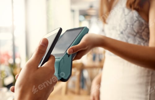 Preview: Shot of a person using contactless payment with a smartphone at a restaurant