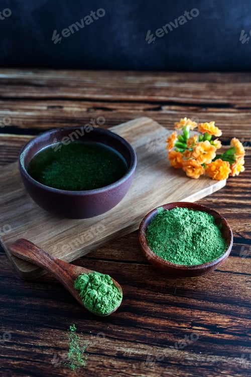 Preview: Green Powder and Liquid on Wooden Surface