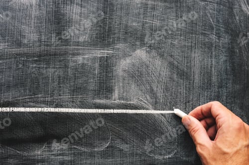 Preview: Hand underlining with chalk on school blackboard