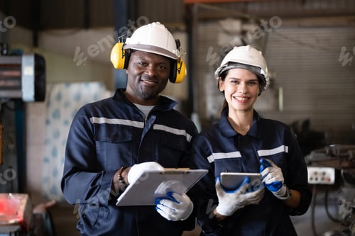 Preview: Two technicians engineers workers holding tablet checking