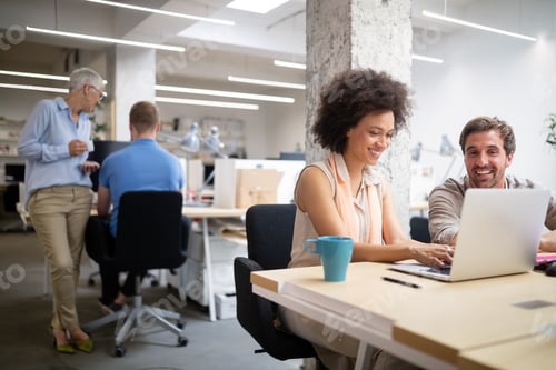 Preview: Cheerful coworkers in office during company meeting