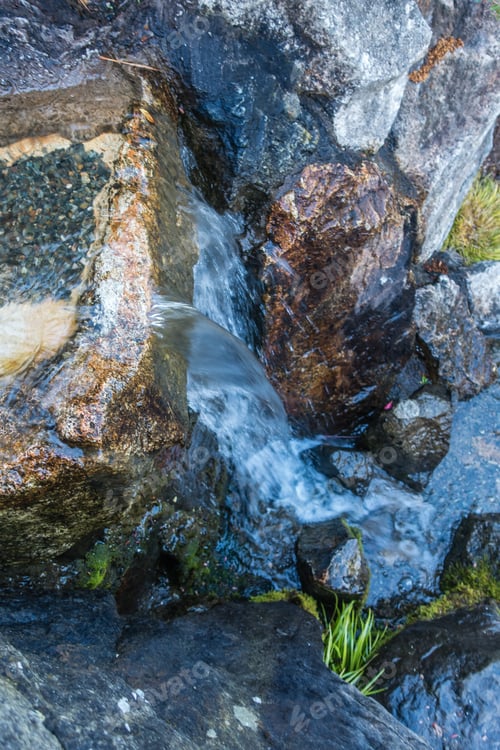 Preview: Closeup Shot Of Water Flowing Over Rocks.