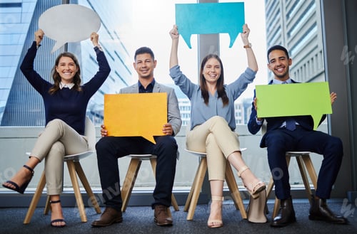 Preview: Shot of a group of young businesspeople holding speech bubbles while waiting in line