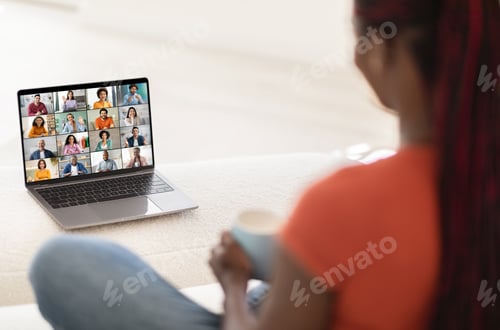 Preview: Woman Participating in Video Conference Meeting on Computer at Home