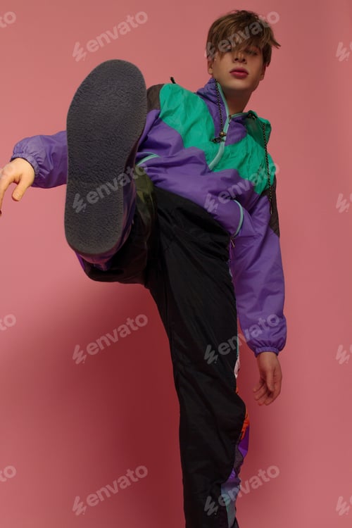 Preview: A Guy Hipster In A Sports Suit Posing On A Pink Background