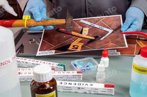 Preview: Police scientist analyses hammer from crime scene at laboratory criminologist