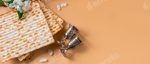 Preview: Happy Passover. Traditional Jewish holiday. Silver wine cups, spring flowers and matzo bread
