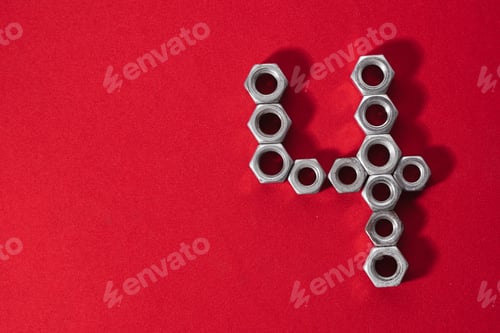 Preview: number four, made with steel nuts on red fabric background