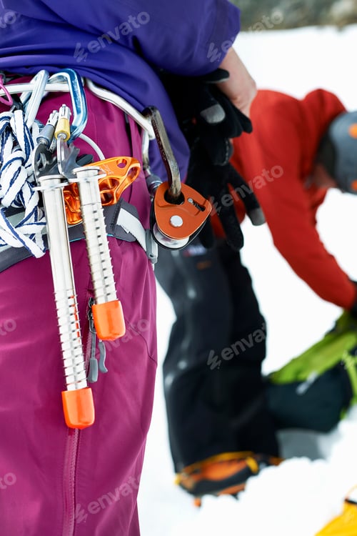 Preview: Close up of mountaineering equipment on mountaineers harness