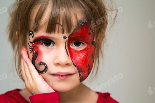 Preview: Portrait of pretty little girl with butterfly painting on her face