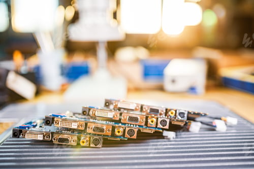 Preview: Close-up electric green embedded microcircuits in production