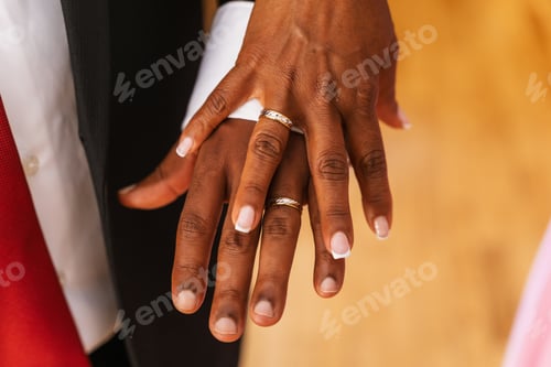Preview: Black ethnic couple embracing with ring at a beautiful wedding, marriage ceremony