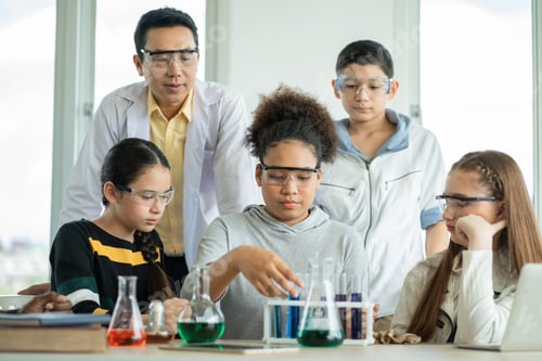 Preview: Diversity group of students in science class doing chemical experiment in laboratory