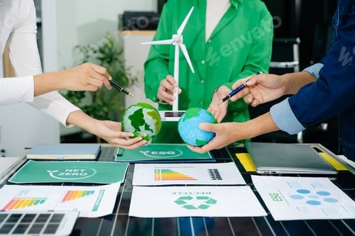 Preview: Business team people planning hand using laptop for working technology and business Net zero
