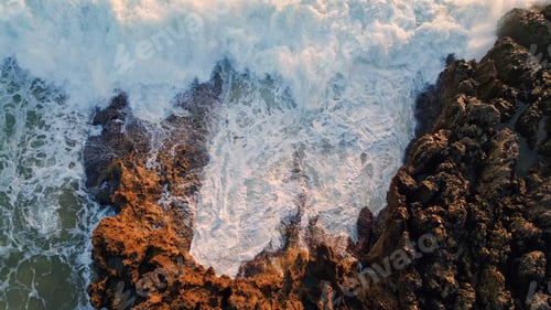 Preview: Aerial view stormy ocean waves breaking volcanic rocks. Water stream landscape