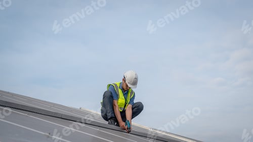Preview: Service engineer checking solar cell on the roof for maintenance if there is a damaged part.