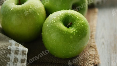 Preview: Green wet apples in drops
