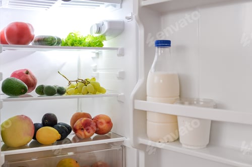 Preview: open fridge with fresh fruits and vegetables. refrigerator with healthy food.Healthy food concept