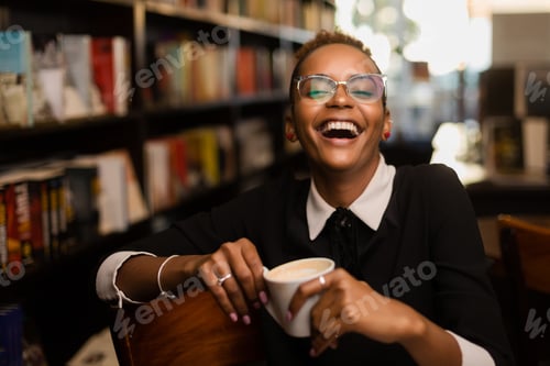 Preview: Black african american young yoman drinking coffee